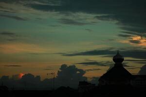 a view of the sunset from the roof of a building photo
