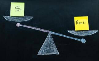abstraction on the topic of real estate. the cost of a renting exceeds the income photo