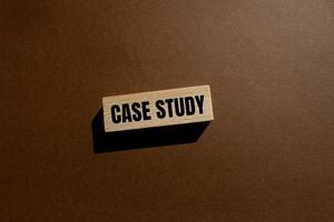 Case study message written on wooden block with brown background. Conceptual case study symbol. Copy space. photo