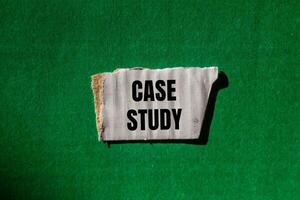 Case study message written on ripped torn white paper piece with green background. Conceptual case study symbol. Copy space. photo