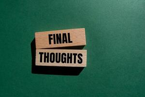 Final thoughts message written on wooden blocks with green background. Conceptual final thoughts symbol. Copy space. photo
