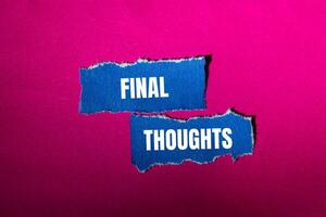 Final thoughts message written on ripped torn blue paper pieces with pink background. Conceptual final thoughts symbol. Copy space. photo