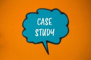 Case study message written on blue paper speech bubble with orange background. Conceptual case study symbol. Copy space. photo