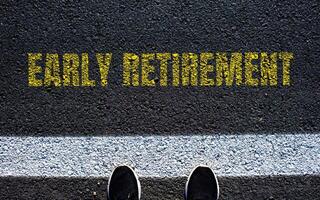Early retirement message written on asphalt road. Conceptual early retirement symbol. Copy space. photo