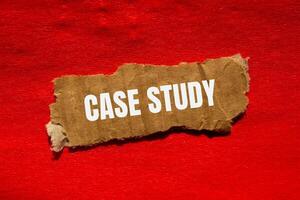 Case study message written on ripped torn cardbaord paper piece with red background. Conceptual case study symbol. Copy space. photo