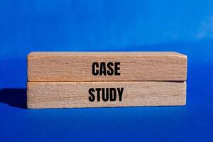 Case study message written on wooden blocks with blue background. Conceptual case study symbol. Copy space. photo