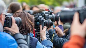A large number of paparazzi and journalists with cameras are filming the event. Horizontal format. photo