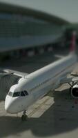 The airplane is currently positioned at the airport gate and is ready for passenger boarding video
