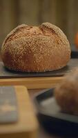 Freshly Baked Artisan Bread Displayed Beautifully on a Rustic Wooden Table Surface video