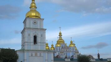 A captivating view of St. Michaels Golden-Domed Monastery in Kiev, Ukraine showcases its stunning architecture and gold domes against a clear sky. video