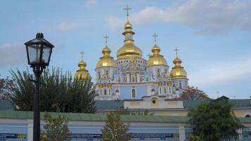 Visit the iconic St. Michaels Golden-Domed Monastery in Kiev, Ukraine, showcasing its impressive golden domes under a clear sky, capturing a moment of peace in this historical location. video