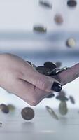 Hands toss coins into the air, with a blurred background, illustrating financial concepts video
