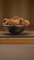 Enjoy a Bowl Filled With Delicious Assorted Nuts Perfect for Healthy and Tasty Snacking video
