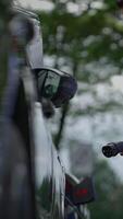 A CloseUp View of a Vehicle Side Mirror Set Against a Natural Background in Nature video