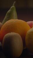 A Vibrant Assortment of Fresh and Colorful Fruits Arranged on a Rustic Wooden Surface video