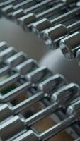 Modern gyms feature shiny chrome weights, enhancing aesthetics for fitness enthusiasts and athletes video