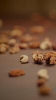 A Colorful Display of Assorted Nuts Beautifully Arranged on a Rustic Background video