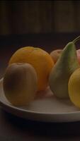 A Beautiful and Appealing Display of Assorted Fresh Fruits Neatly Arranged on a Neutral Plate video