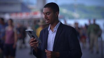 A person on a call using a tablet, showing interest and attentiveness in communication video