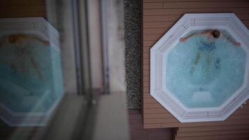 Relaxing in a Hot Tub A Tranquil Scenic Overhead View That Invites Serenity and Comfort video