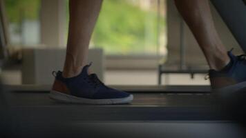 Detailed CloseUp of Running Shoes on a Treadmill During an Intense Workout Session video