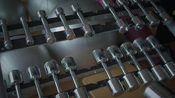 A Variety of Assorted Dumbbells Presented in a Contemporary Gym Environment and Setting video