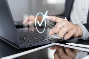 Businessman touching approved document icon on digital documents for approve business project proposals. photo