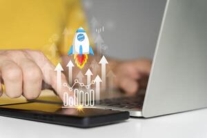 Businessman launching a transparent rocket icon, concept of startup business taking off and achieving success photo