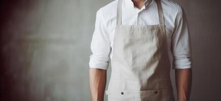 Man wearing beige linen apron mock up in the modern kitchen, chef uniform for cooking photo
