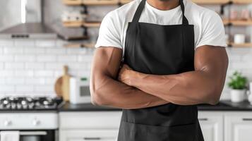 Man wearing black apron mock up in the modern kitchen, chef uniform for cooking photo