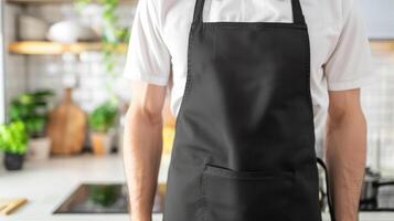 Man wearing black apron mock up in the modern kitchen, chef uniform for cooking photo
