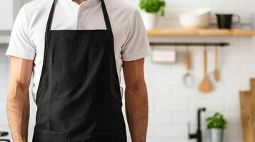 Man wearing black apron mock up in the modern kitchen, chef uniform for cooking photo