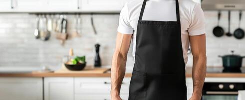 Man wearing black apron mock up in the modern kitchen, chef uniform for cooking photo