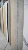 Large size ceramic tile collection in hardware store. Vertical video