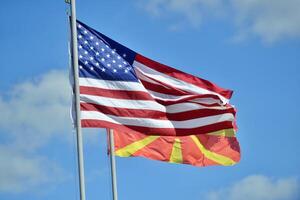 American and Macedonian flags. Language learning, international business or travel concept. photo