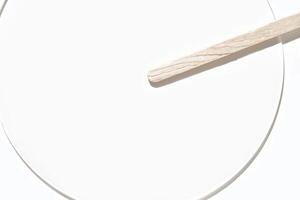 Minimalist wood and white aesthetic with light shadow play on circular geometric shapes for modern design inspiration photo