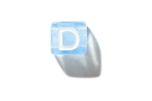 Clear blue ice cube with engraved letter d on white background shadow minimal art design photo