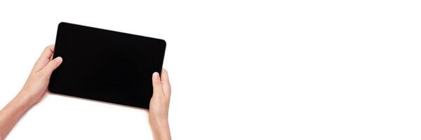 Minimalist technology concept. hands holding a tablet with blank screen for app design or presentation mockup. Horizontal banner photo