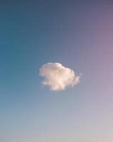 A lone cloud floating in the sky photo
