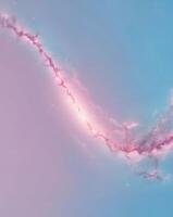 A pink and blue galaxy with a bright star photo