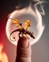 Tiny Dragon Sitting on a Finger Amidst Flames. photo