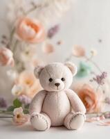 Teddy Bear on a soft pastel floral background. photo