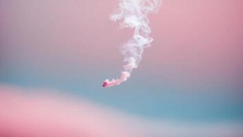 A pink smoke cloud is seen in the air photo
