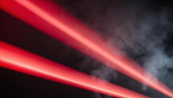 A red light beam is shown in the dark photo