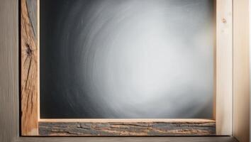 A wooden frame with a blackboard on it photo