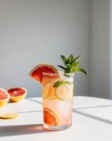 A glass of pink grapefruit and lime juice photo