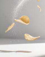 A potato chip falling into the air photo