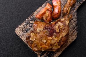 Duck leg baked with apples and sauce photo