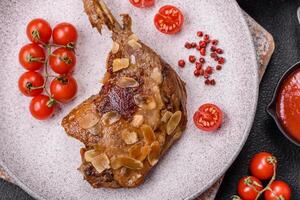 Duck leg baked with apples and sauce photo