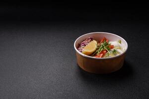 Salad with tuna pieces, boiled egg, cherry tomatoes, lettuce photo